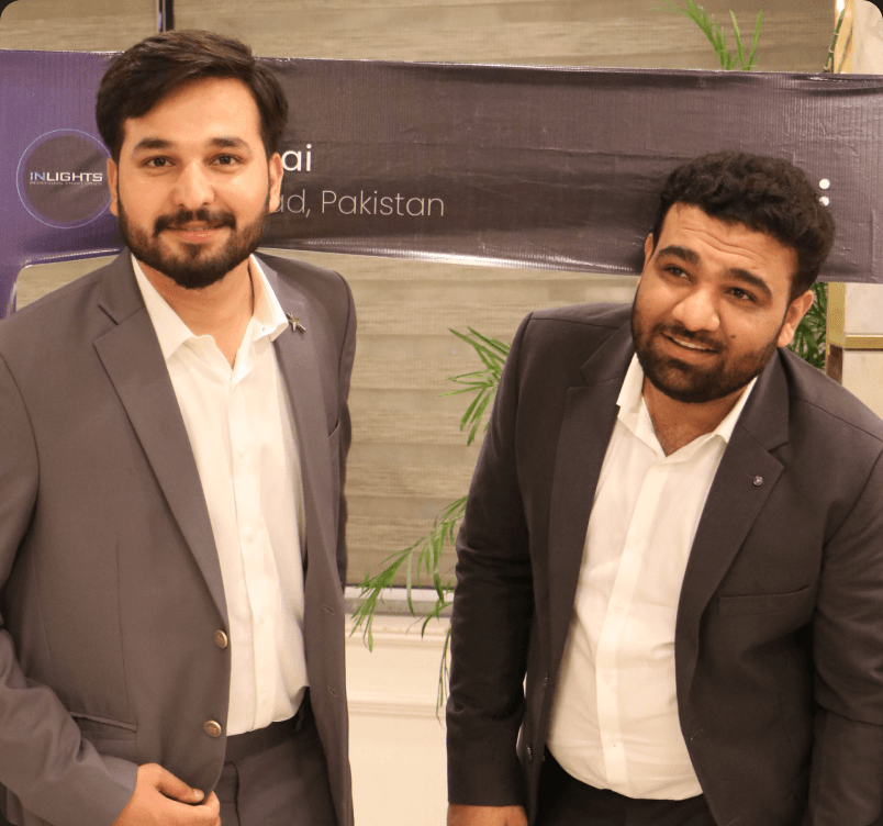 InLights team beside the company banner at an event
