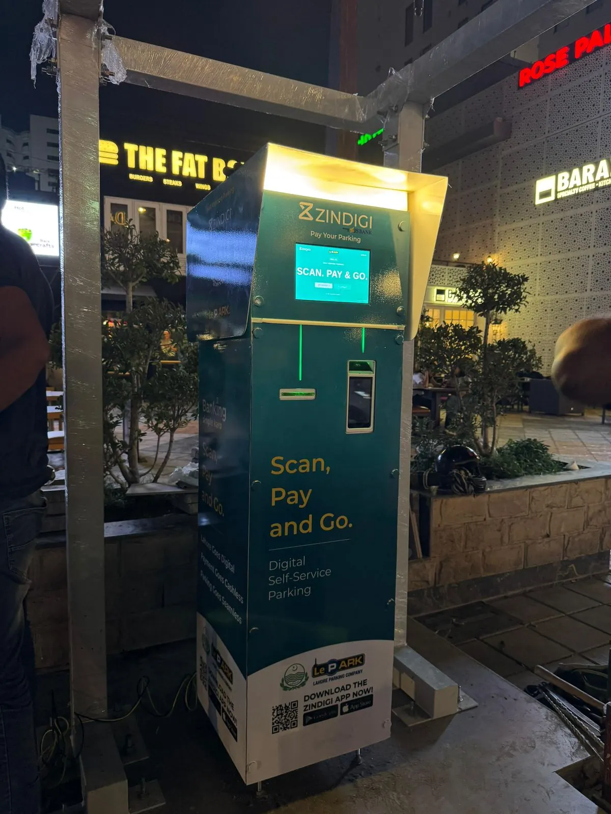 Zindigi parking kiosk installed under a canopy on the street