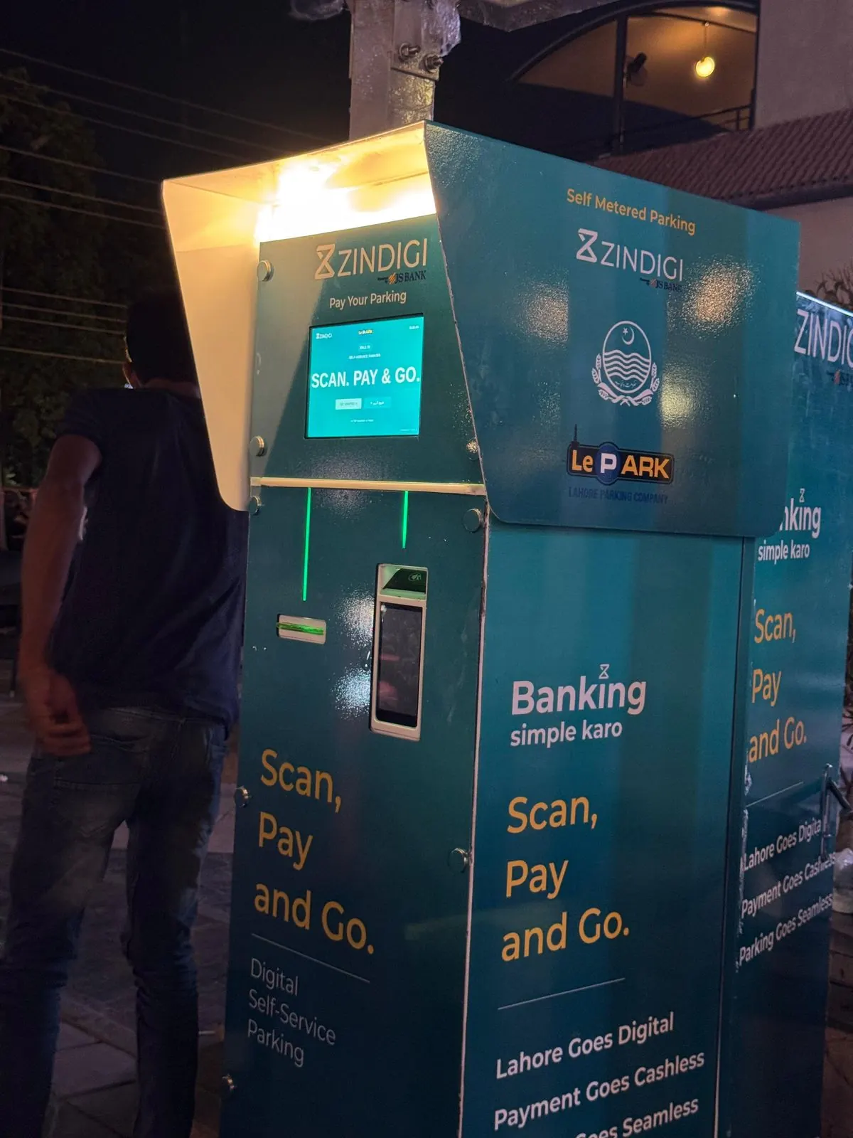 Zindigi self-service parking kiosk in an urban setting