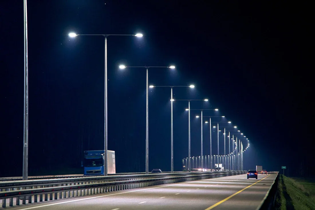 Street lights illuminating a road at night